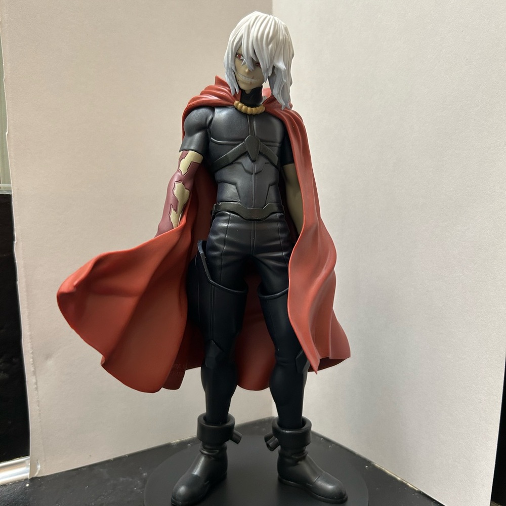 Anime Figure with Red Cape and Gray Hair